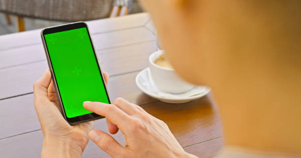 istock Close-up of woman using smartphone 1438382478