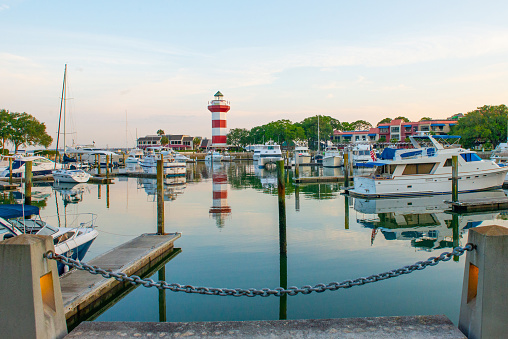 Speed Boats, Fishing Boats, and Flags flying along a tree lined inland water way - it's a Tampa Bay Florida area Lifestyle that will laways includes the Water