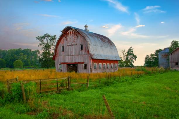 istock Old weathered Red Barn at sunrise-Howard County, Indiana 1438384084