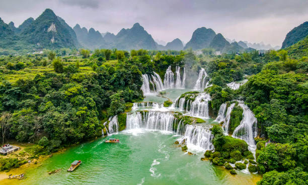 Aerial view of “ Ban Gioc “ waterfall, Cao Bang, Vietnam. “ Ban Gioc “ waterfall is one of the top 10 waterfalls in the world. Aerial view of “ Ban Gioc “ waterfall, Cao Bang, Vietnam. “ Ban Gioc “ waterfall is one of the top 10 waterfalls in the world. vietnam stock pictures, royalty-free photos & images