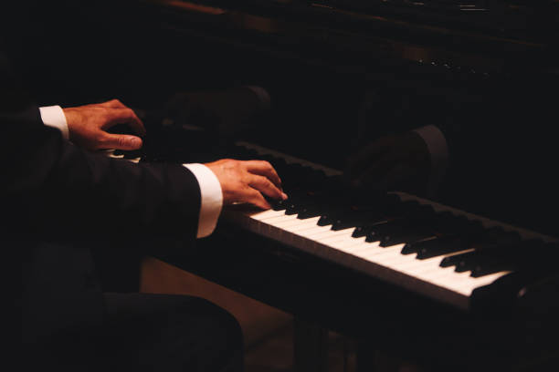 istock pianist playing on grand piano 1438385509