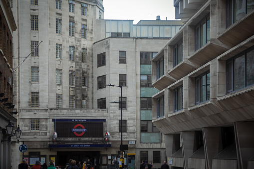 Blurred view of historic stone office buildings on Minories street. London. UK