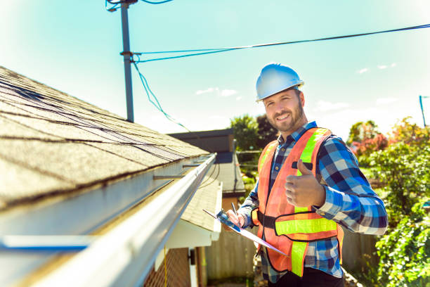 istock man with hard hat standing on steps inspecting house roof 1438389431
