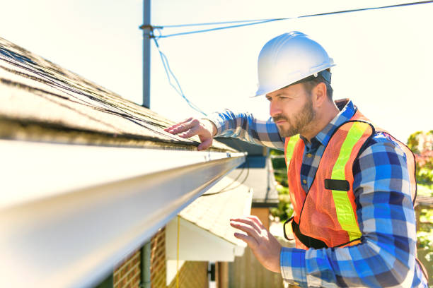 istock man with hard hat standing on steps inspecting house roof 1438389442