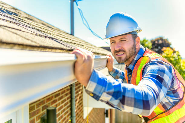 istock man with hard hat standing on steps inspecting house roof 1438389474
