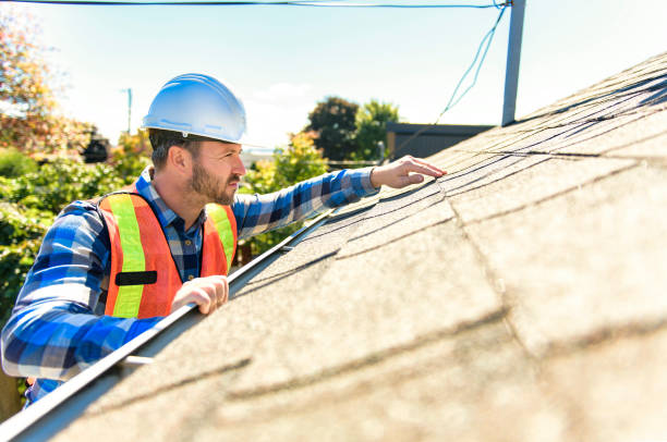 man with hard hat standing on steps inspecting house roof A man with hard hat standing on steps inspecting house roof inspector stock pictures, royalty-free photos & images