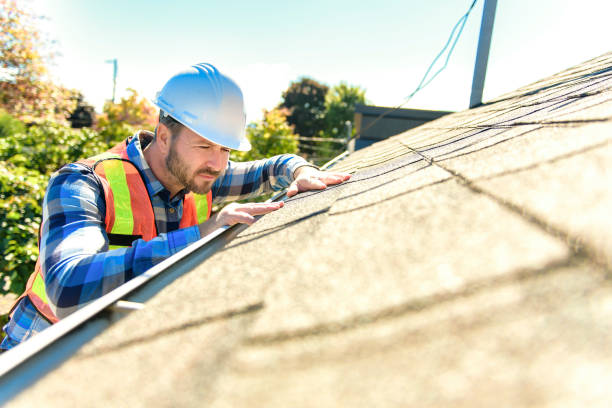 istock man with hard hat standing on steps inspecting house roof 1438389514