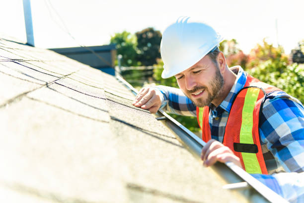 istock man with hard hat standing on steps inspecting house roof 1438389537