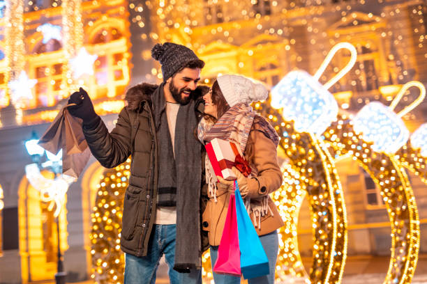 istock Couple having fun doing Christmas shopping 1438390154