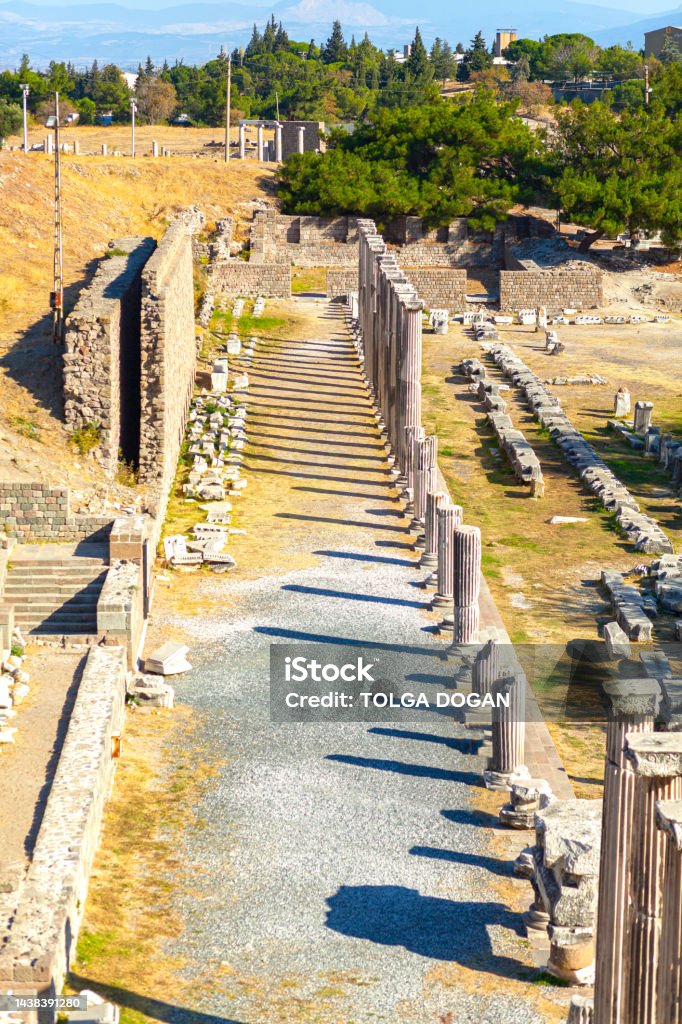 Pergamon Antique Sanitarium: Asklepion View of the gateway towards the amphitheatre, surrounded by Trajan's Columns in Asklepion; antique sanitarium in Pergamon antique city, Bergama, Turkey Zeus Stock Photo