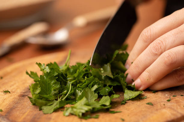istock Parsley chopping on wooden board 1438392443