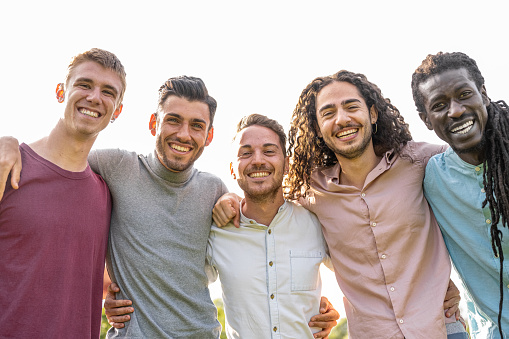 Five young men, happy friends and brothers, family reunion