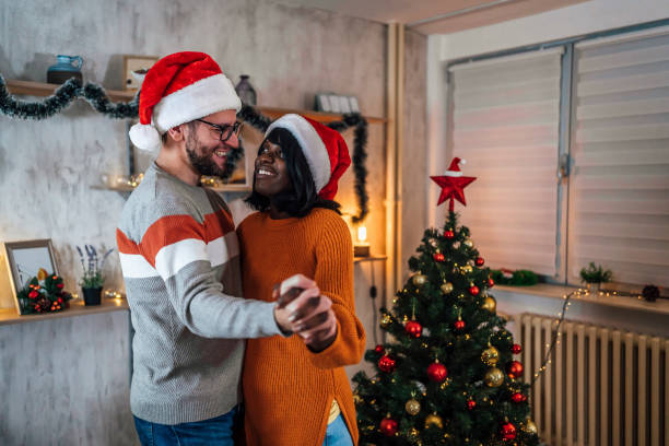 istock Couple dancing during cozy Christmas holidays 1438393736