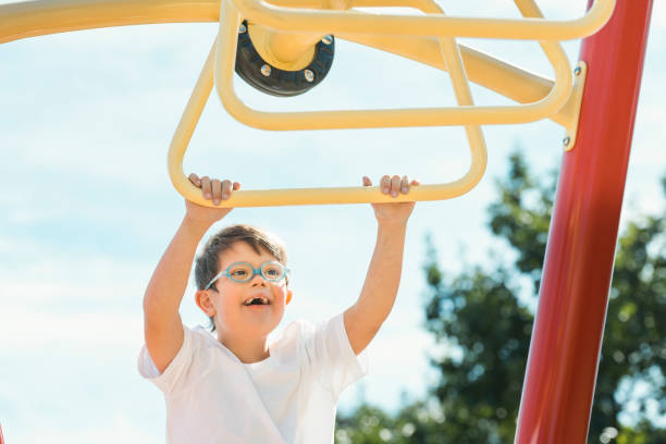 istock child boy having fun on the playground 1438393879