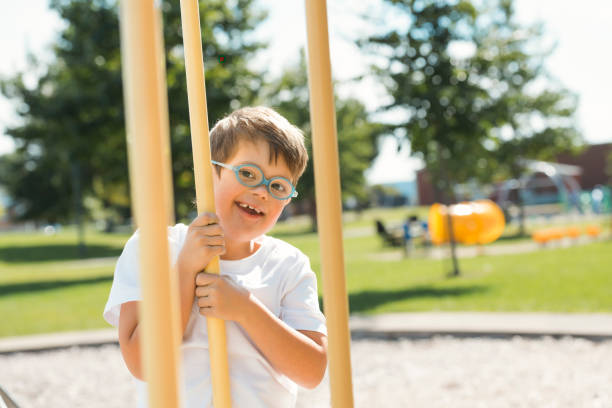 istock child boy having fun on the playground 1438393880