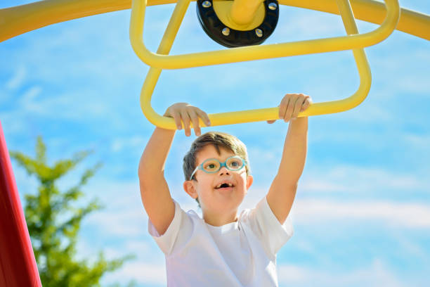 istock child boy having fun on the playground 1438393884
