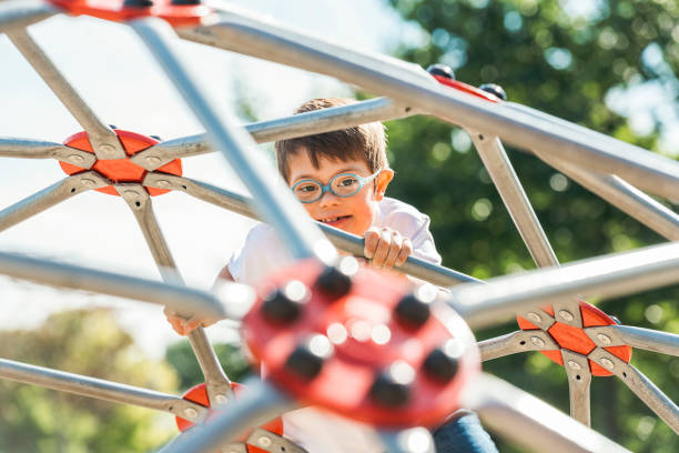 istock child boy having fun on the playground 1438393911