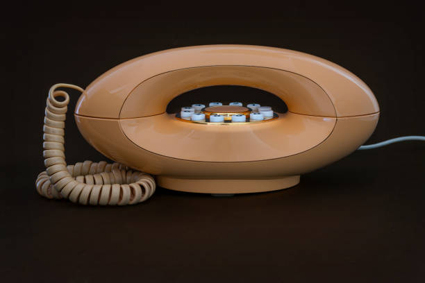 Peach coloured 1970's Modern telephone handset