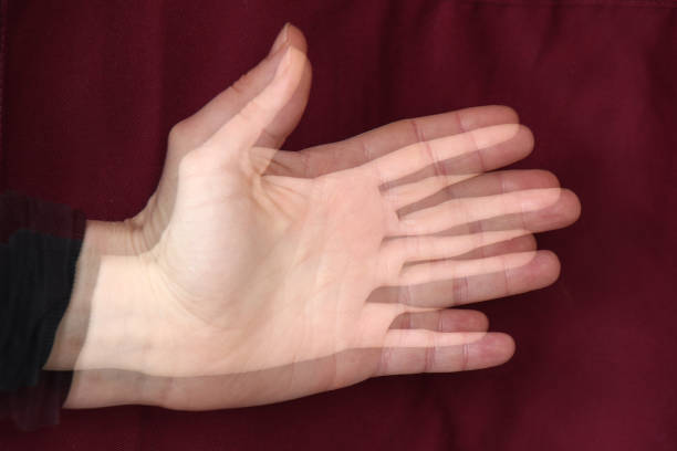 A shaking hand showing tremors due to desease such as Parkinson or senile dementia