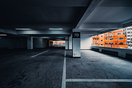 Empty underground parking with lots for cars