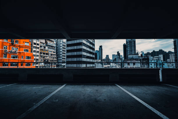 interior of parking garage with car and vacant parking lot in parking building - hong kong china city night imagens e fotografias de stock