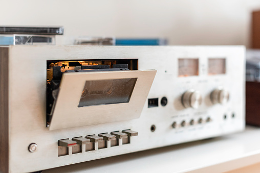 A needle on a turntable that plays music