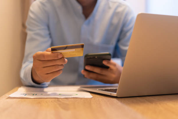istock Business man holding credit card payment internet banking cyberspace commerce technology online shopping. 1438403306
