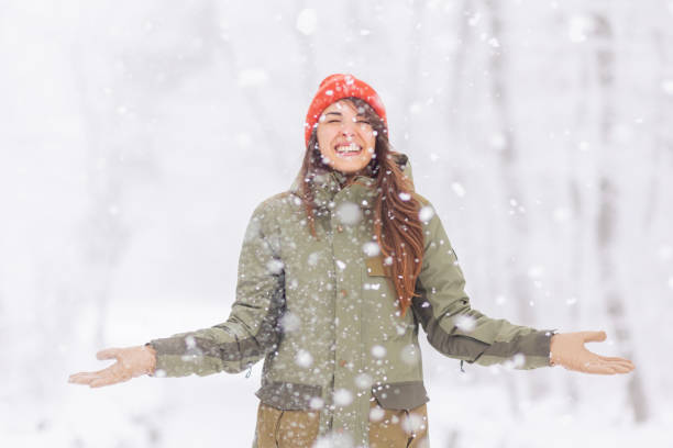 istock Woman relaxing outdoors on snowy winter day 1438403321