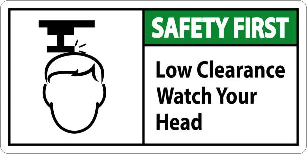 Vector illustration of Safety First Low Clearance Watch Your Head Sign