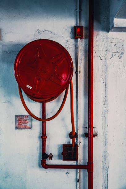 istock Fire extinguisher with various types of fire extinguishers Located in the fire escape door in the parking lot 1438403678