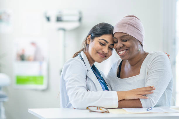 istock Oncologist Comforting a Cancer Patient 1438404024