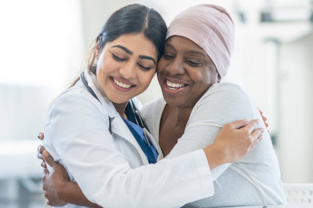 istock Oncologist Comforting a Cancer Patient 1438404037