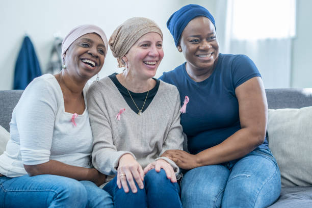 women showing breast cancer awareness - medical exam doctor patient adult imagens e fotografias de stock