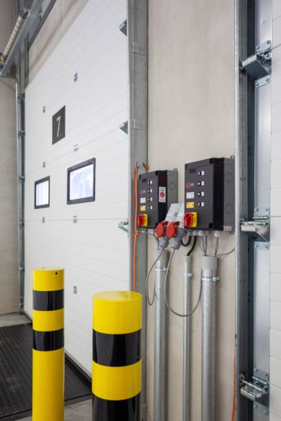 istock Vertical shot of the control panels for loading bay doors inside a warehouse 1438404598