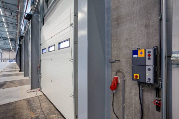istock Interior shot of a warehouse with a control panel next to the door 1438405337