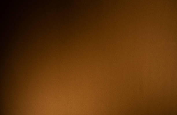 istock Brown background with textured paper and natural light 1438410355