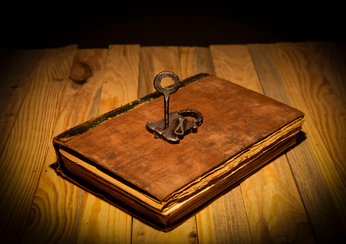 Unlock the potential of knowledge theme with vintage book and key lock.