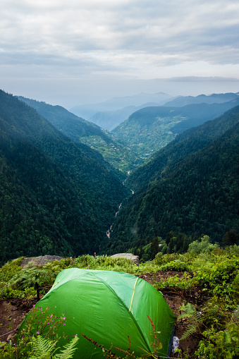 July 14th 2022, Himachal Pradesh India. Tents and camps with beautiful landscapes, valley and mountains in the background. Shrikhand Mahadev Kailash Yatra in the Himalayas.