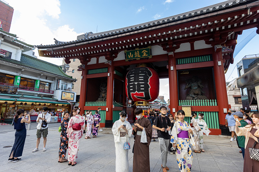 Tokyo, Japan - September 6, 2022 : People at Senso-ji Buddhist Temple in Asakusa, Tokyo, Japan. Senso-ji Temple is symbol of Asakusa and one of the most famous temples in Japan.