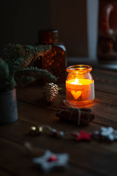 istock candle light and christmas decoration 1438417528