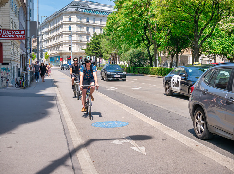 Vienna, Austria- June 2022: Cyclists riding bicycles on the special lanes in Vienna, Austria