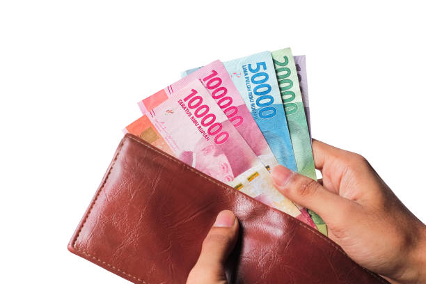 istock Hand showing rupiah money from wallet isolated on white background 1438422889