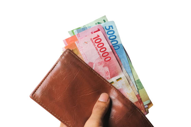 istock Hand showing rupiah money from wallet isolated on white background 1438422915
