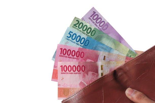 istock Hand showing rupiah money from wallet isolated on white background 1438422923