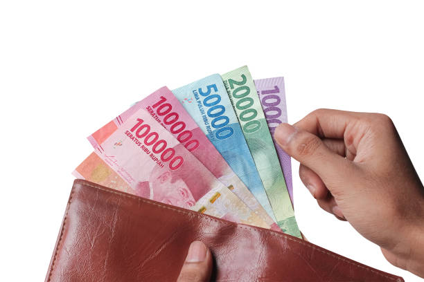 istock Hand showing rupiah money from wallet isolated on white background 1438422932