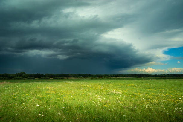 istock View of the dark thundercloud above the meadow 1438424128