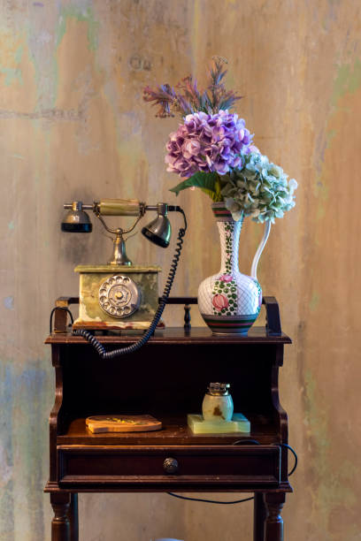 istock Interior design vintage table with flowers. Attic, rustic style. 1438424391