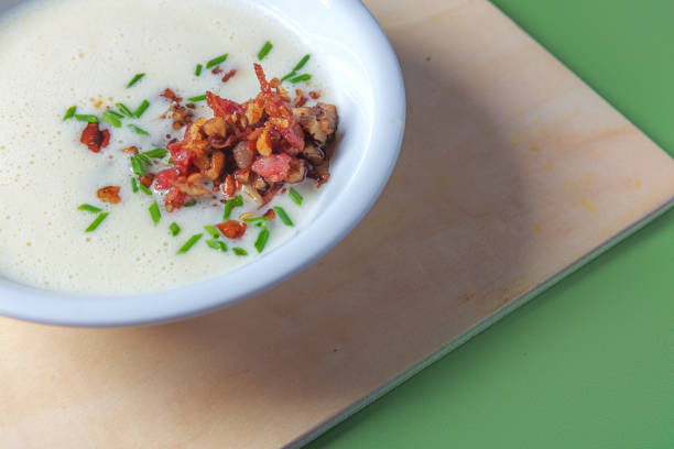 istock Soup cream with chorizo pieces on green background. 1438425692