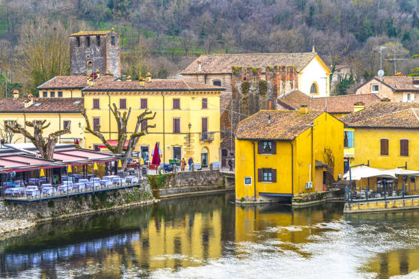 High angle view of Borghetto sul Mincio with the buildings reflecting on the water stock photo