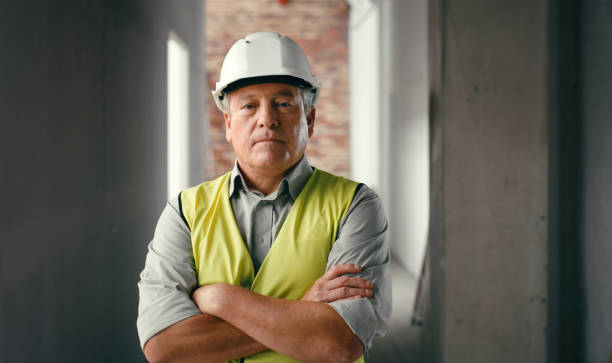 Management, construction worker and arms crossed with portrait of man and working on architecture, engineering or industrial. Designer, leadership or vision with employee working on construction site Management, construction worker and arms crossed with portrait of man and working on architecture, engineering or industrial. Designer, leadership or vision with employee working on construction site carpenter portrait stock pictures, royalty-free photos & images